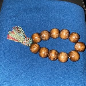 Boho, old (vintage possibly) wooden beads stretch bracelet with tassel
